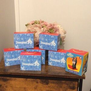 Disneyland 70th Anniversary Collectible Boxes  lot of 7 unopened with toy inside